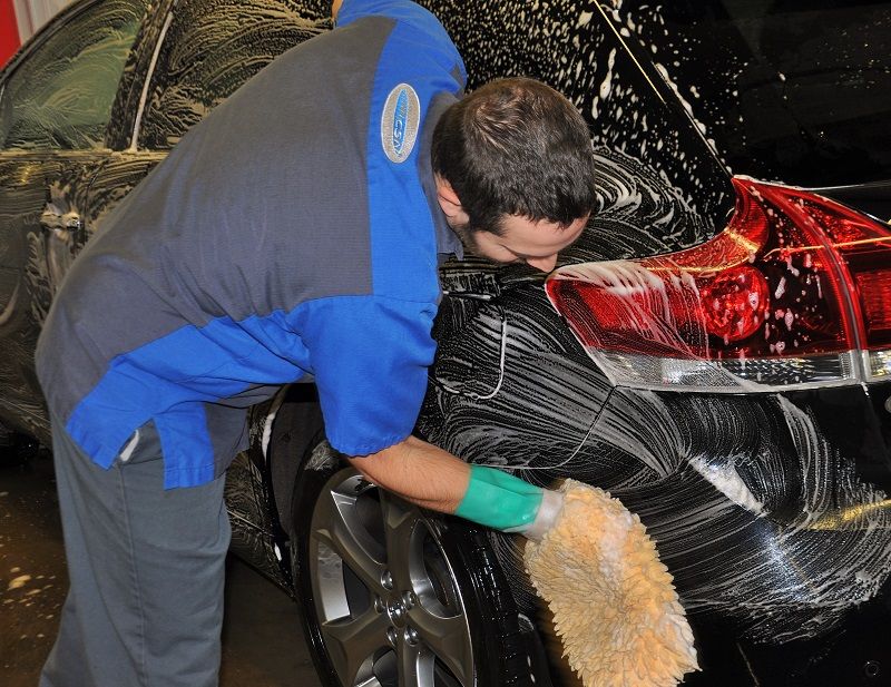 a car being washed at champlain auto body collision repair center